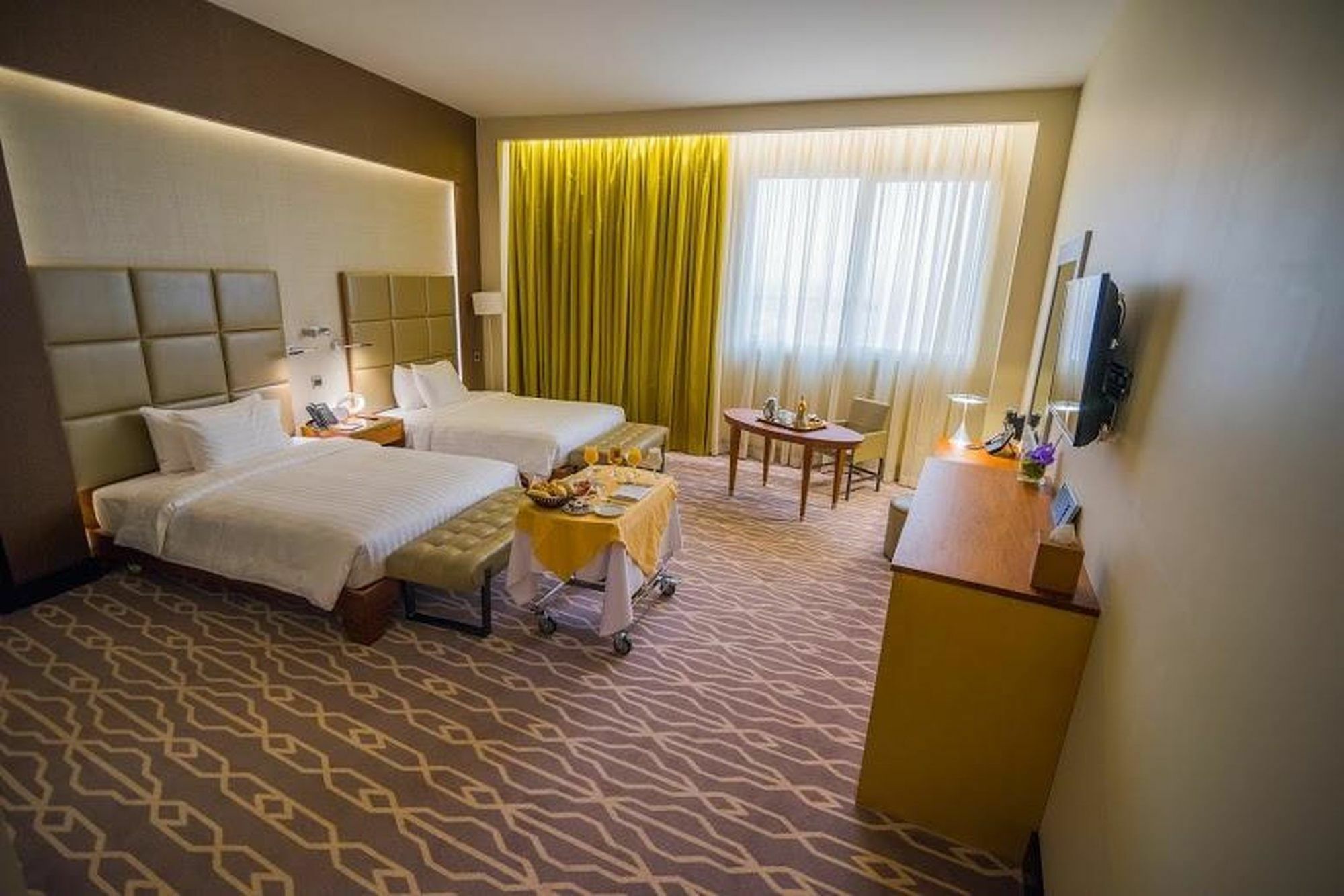 Millennium Hail Hotel Extérieur photo A room at the hotel